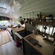 Image for article titled This Wild School Bus RV Has Underglow And A Fire Pit On Its Roof